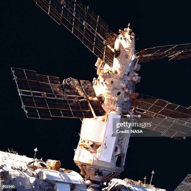 Russia's Mir Space Station's Spektr Module shows the backside of a solar array panel and damage incurred by the impact of a Russian unmanned Progress...