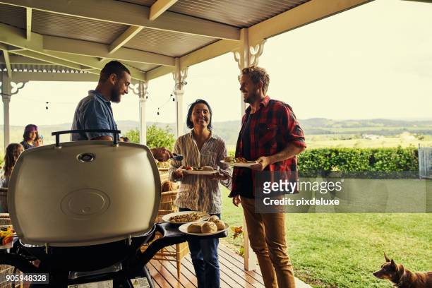 making sure they give compliments to the chef - bbq australia stock pictures, royalty-free photos & images