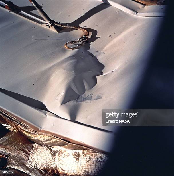 Close-up view of a radiator panel on Russian Mir Space Station's Spektr Module shows damage incurred by the impact of a Russian unmanned Progress...