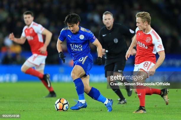 Shinji Okazaki of Leicester battles with Kyle Dempsey of Fleetwood during The Emirates FA Cup Third Round Replay match between Leicester City and...