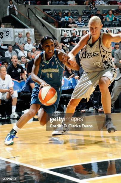 Candice Wiggins of the Minnesota Lynx drives to the basket past Ann Wauters of the San Antonio Silver Stars during the WNBA game on September 1, 2009...