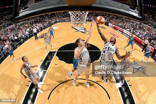 Sophia Young and Ruth Riley of the San Antonio Silver Stars reach for a rebound during the WNBA game against the Minnesota Lynx on September 1, 2009...