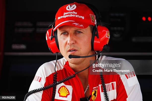 Former Ferrari F1 World Champion Michael Schumacher of Germany is seen in the pitlane during practice for the Italian Formula One Grand Prix at the...