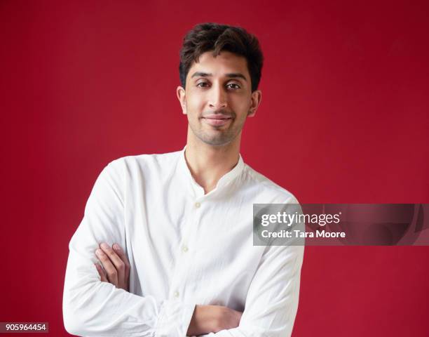 portrait of young man looking to camera - waist up stock pictures, royalty-free photos & images