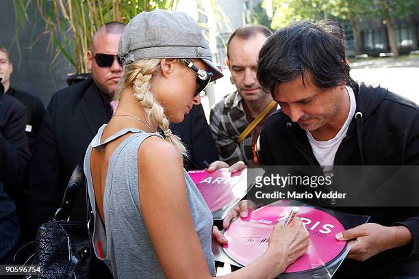 Paris Hilton writes autographs at the Roomers Hotel during a short visit to Germany on September 11, 2009 in Frankfurt am Main, Germany. Prinz Marcus...
