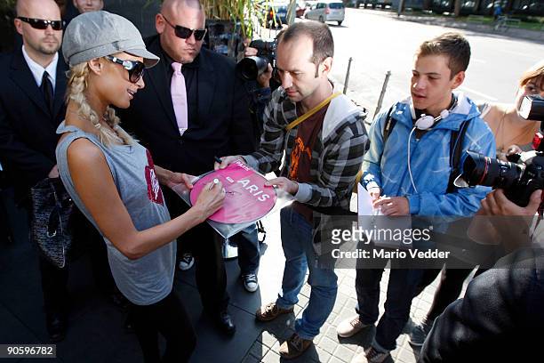 Paris Hilton acts with some fans at the Roomers Hotel during a short visit to Germany on September 11, 2009 in Frankfurt am Main, Germany. Prinz...