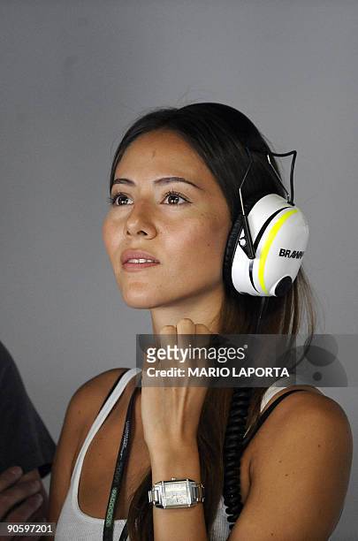 The girlfriend of Brawn GP's British driver Jenson Button, Jessica Michibata is pictured in the pits of at the Autodromo Nazionale circuit on...