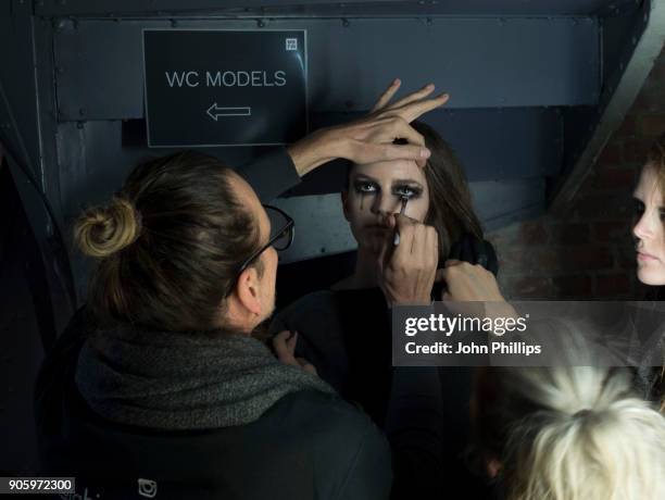 Models gets prepared backstage ahead of the Irene Luft show during the MBFW January 2018 at ewerk on January 17, 2018 in Berlin, Germany.