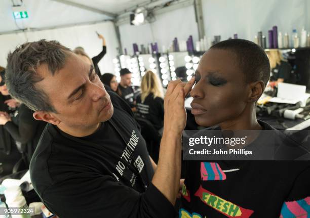 Models gets prepared backstage ahead of the Irene Luft show during the MBFW January 2018 at ewerk on January 17, 2018 in Berlin, Germany.