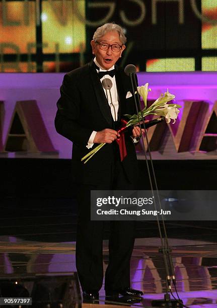 Actor Akira Kume speaks after winning the Best Actor award for the drama "The Shopping Trip" at the Seoul International Drama Awards 2009 at the...