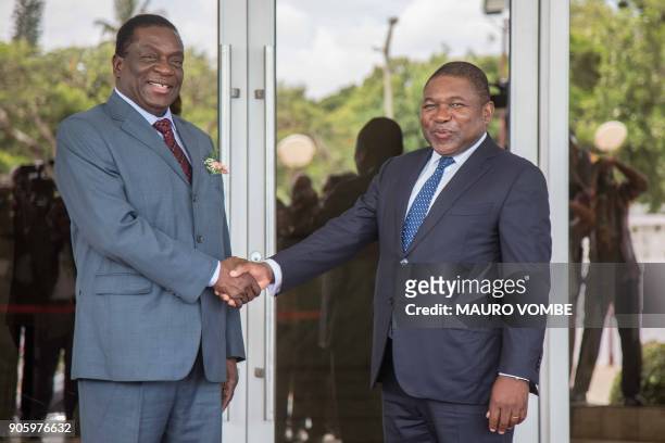 Zimbabwean President Emmerson Mnangagwa shakes hands with Mozambican President Filipe Nyusi upon his arrival for a state visit on January 17, 2018 in...