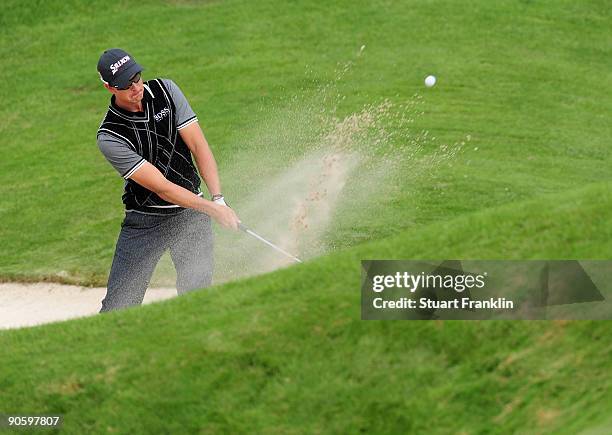 Henrik Stenson of Sweden plays his bunker shot on the 13th hole during the second round of The Mercedes-Benz Championship at The Gut Larchenhof Golf...