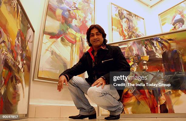 Artist Niladri Paul during his painting exhibition named 'Concert of Colours' at Santushti Shopping Arcade, New Delhi.