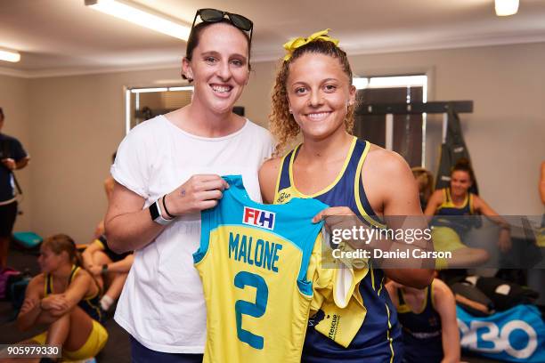Madonna Blyth presents Ambrosia Malone of the Hockeyroos her bodysuit on debut in the rooms during game two of the International Test Series between...