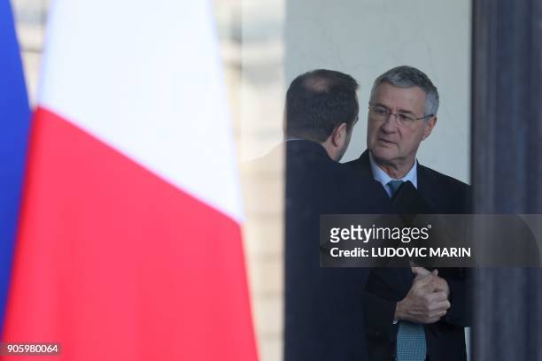 Elysee Chief of Staff Patrick Strzoda speaks to a minister following the weekly cabinet meeting on January 17 in Paris. / AFP PHOTO / LUDOVIC MARIN