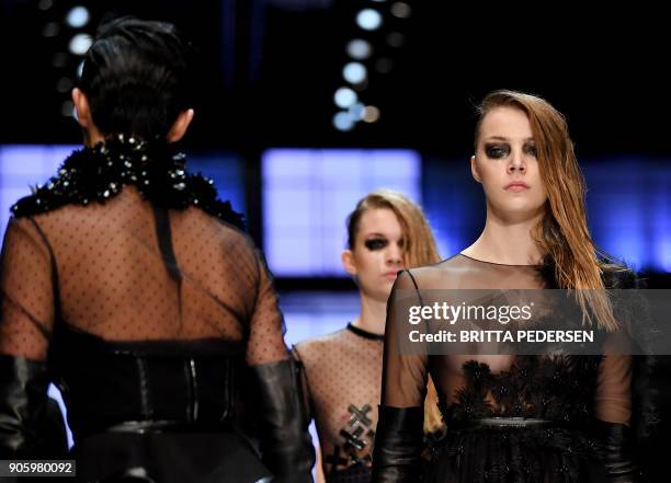 Model present a creation by the label "Irene Luft" during the Fashion Week in Berlin on January 17, 2018. / AFP PHOTO / dpa / Britta Pedersen /...