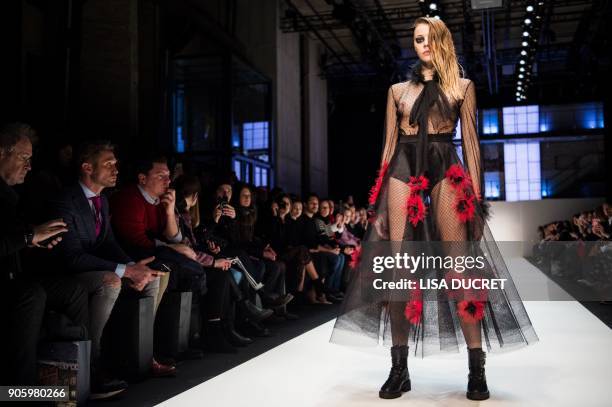 Model presents a creation by the label "Irene Luft" during the Fashion Week in Berlin on January 17, 2018. / AFP PHOTO / dpa / Lisa Ducret / Germany...