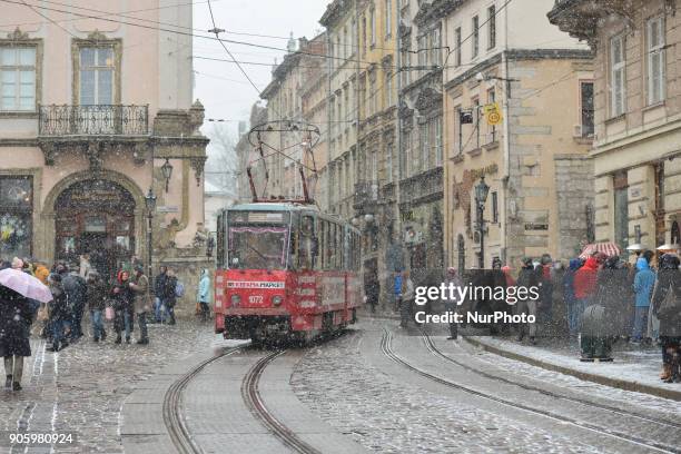 View of Rynok Square in the center of Lviv town during a snow showers. On Sunday, January 14 in Lviv, Lviv Oblast, Ukraine.