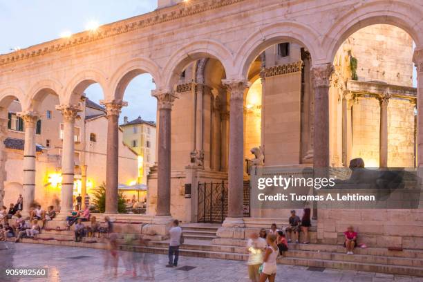 tourists at peristyle in split - split croatia stock pictures, royalty-free photos & images
