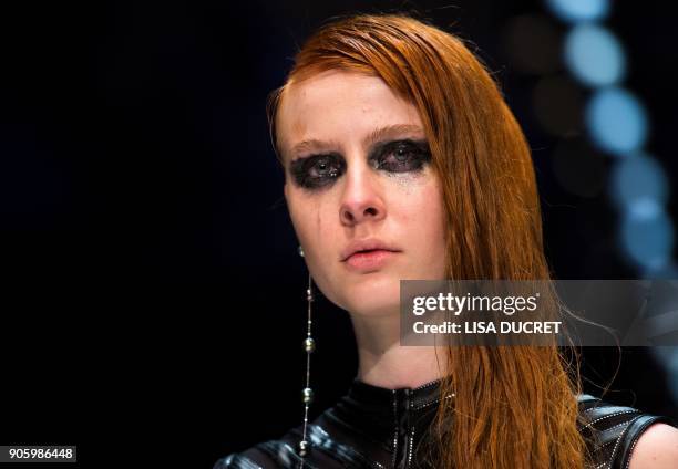 Model presents a creation by the label "Irene Luft" during the Fashion Week in Berlin on January 17, 2018. / AFP PHOTO / dpa / Lisa Ducret / Germany...