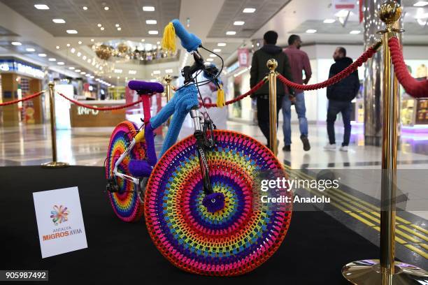 Bicycle covered with wool is seen during the Woolen Tales exhibition at Migros Shopping Mall in Antalya, Turkey on January 17, 2018. Academicians and...