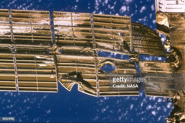 Close-up view of the solar array panel on Russia's Mir Space Station's shows damage incurred by the impact of a Russian unmanned Progress re-supply...