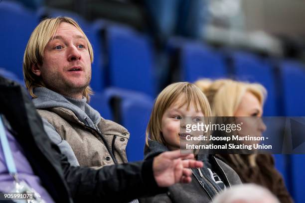 Evgeni Plushenko looks on with his son and husband in the Men's Short Program during day one of the European Figure Skating Championships at...
