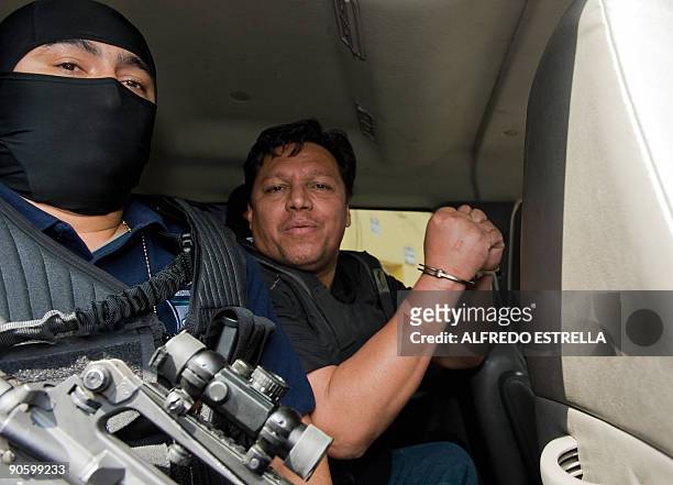 Bolivian preacher Jose Marc Flores Pereira , hijacker of an Aeromexico airliner two days ago, is escorted by security officers in Mexico City on...