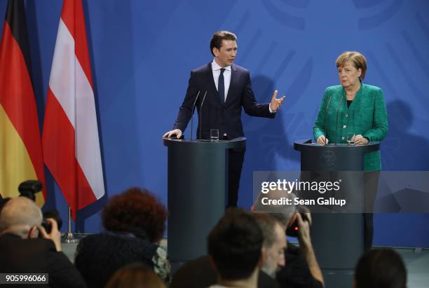 German Chancellor Angela Merkel and new Austrian Chancellor Sebastian Kurz speak to the media following talks at the Chancellery on January 17, 2017...