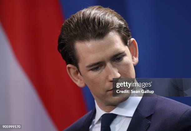 New Austrian Chancellor Sebastian Kurz and German Chancellor Angela Merkel speak to the media following talks at the Chancellery on January 17, 2017...