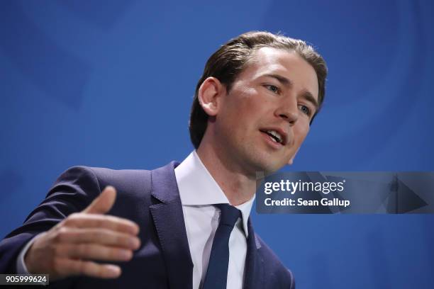 New Austrian Chancellor Sebastian Kurz and German Chancellor Angela Merkel speak to the media following talks at the Chancellery on January 17, 2017...