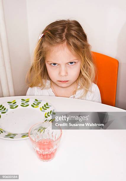 a scandinavian girl eating sweden. - hunger stock-fotos und bilder