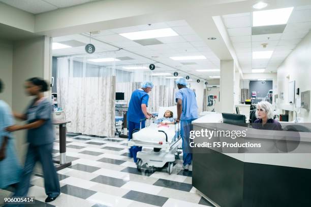 nurses station in busy hospital - ward stockfoto's en -beelden