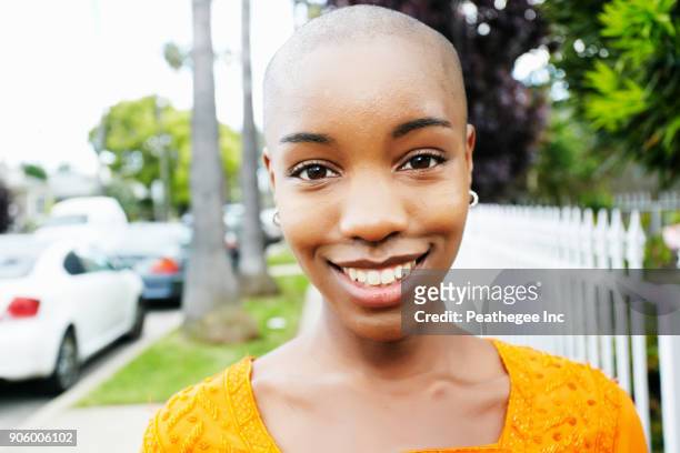 portrait of bald smiling black woman - hair loss stock pictures, royalty-free photos & images