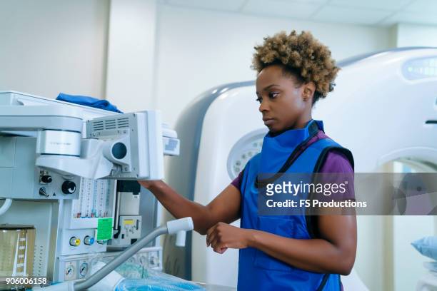 black hospital technician wearing protective vest - x-ray technician stock pictures, royalty-free photos & images