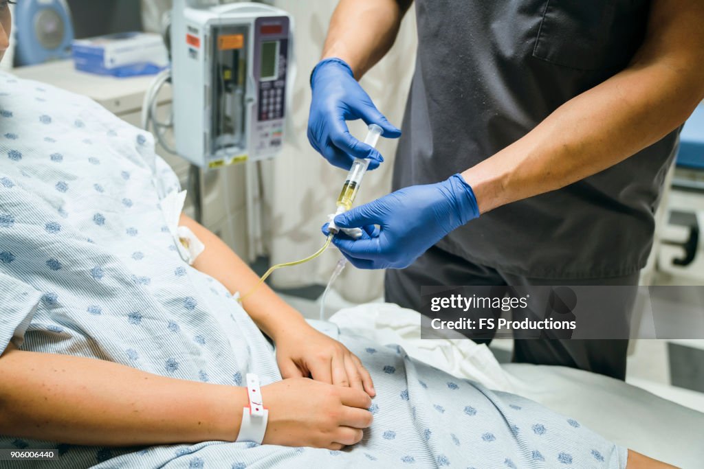 Injecting Injection Hospital Nurse Injecting Medicine Into Tube Of Patient High-Res Stock Photo ...