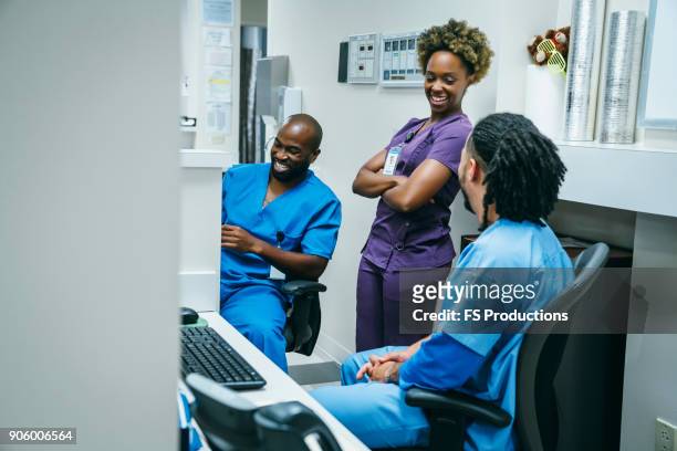 nurses laughing in hospital - houston texas space stock pictures, royalty-free photos & images