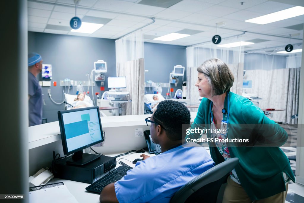 Nurse Ringing Computer Doctor And Nurse Using Computer High-Res Stock Photo - Getty Images
