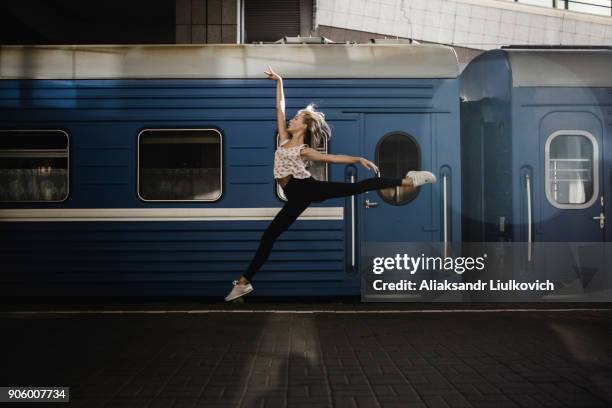 caucasian woman dancing near train - urban ballet imagens e fotografias de stock