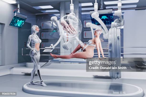 futuristic nurses examining expectant mother - robot surgery stock pictures, royalty-free photos & images