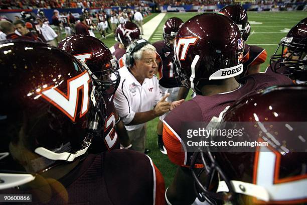 Assistant Coach Billy Hite of the Virginia Tech Hokies gives instructions during the Chick-fil-A Kickoff Game against the Alabama Crimson Tide at the...
