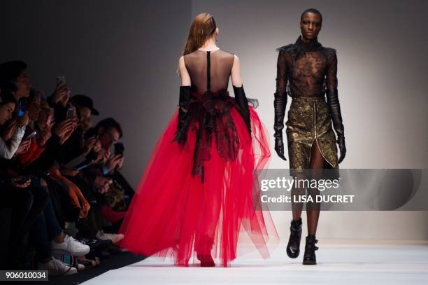 Models present creations by the label "Irene Luft" during the Fashion Week in Berlin on January 17, 2018. / AFP PHOTO / dpa / Lisa Ducret / Germany...