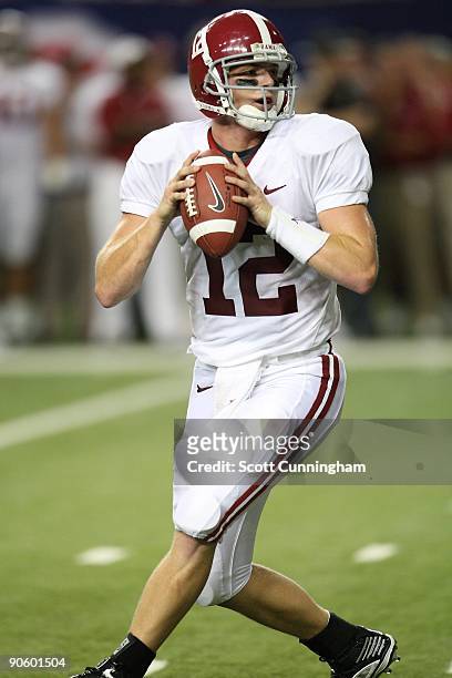 Greg McElroy of the Alabama Crimson Tide passes during the Chick-fil-A Kickoff Game against the Virginia Tech Hokies at the Georgia Dome on September...