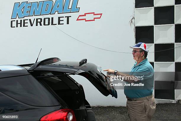 David Ingram shops for a new car as he checks out a General Motor's Chevrolet brand Equinox vehicle at the Kendall Chevrolet at The Dadeland Mall car...