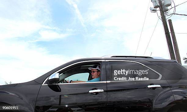 David Ingram shops for a new car as he checks out a General Motor's Chevrolet brand Equinox vehicle at the Kendall Chevrolet at The Dadeland Mall car...