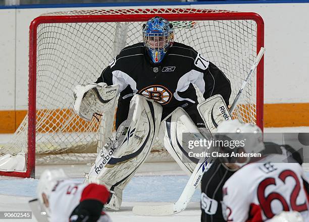 Goaltender Michael Hutchinson of the Boston Bruins defends his net during a game against the Ottawa Senators in the NHL Rookie Tournament on...