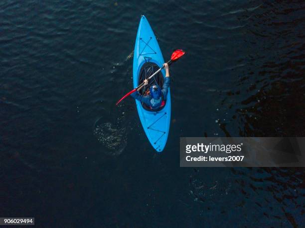 aerial view of a kayaker on a river, dublin, ireland. - kayak stock pictures, royalty-free photos & images