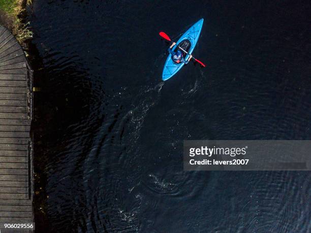 aerial view of a kayaker on a river, dublin, ireland. - dublin aerial stock pictures, royalty-free photos & images