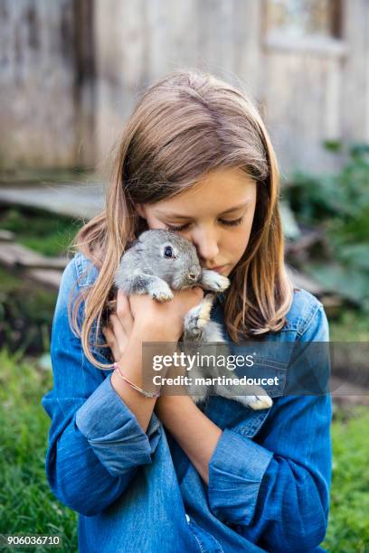 Girl Hugging Rabbit Photos and Premium High Res Pictures - Getty Images