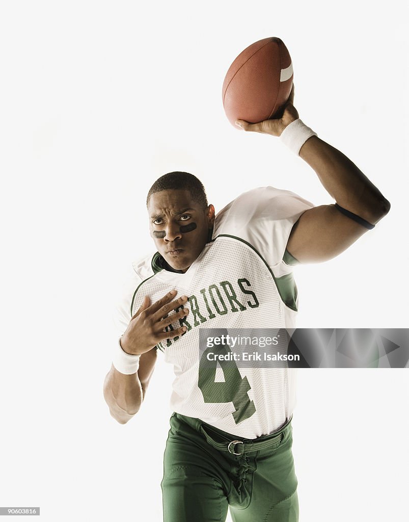 African quarterback throwing football